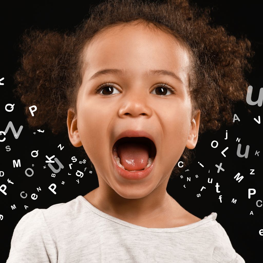 Portrait of little African-American girl on dark background