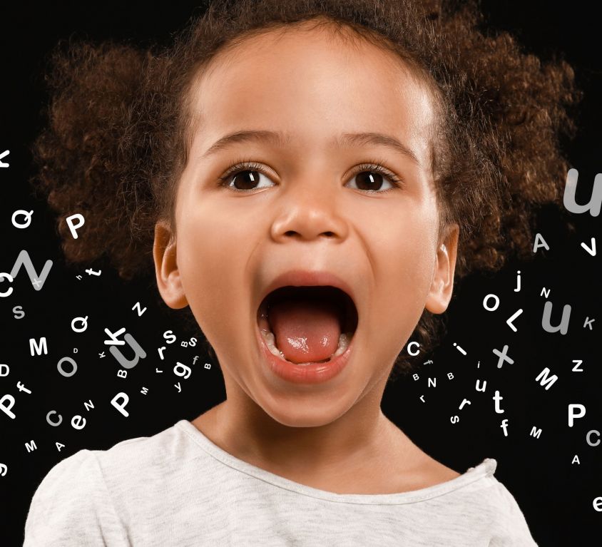 Portrait of little African-American girl on dark background